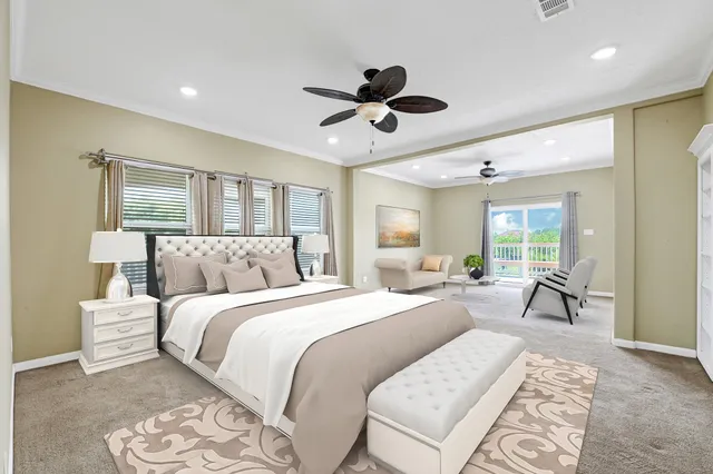 a spacious bedroom with a large bed and a large window