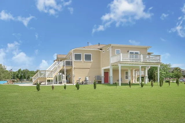 a view of a house with a big yard