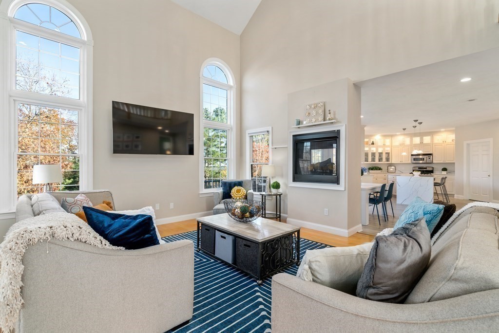 48 Mohawk Path Holliston, MA 01746 - Photo 11 of 41 a living room with furniture and a flat screen tv