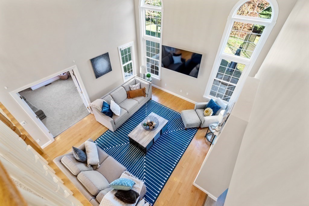 48 Mohawk Path Holliston, MA 01746 - Photo 12 of 41 a living room with furniture and a flat screen tv
