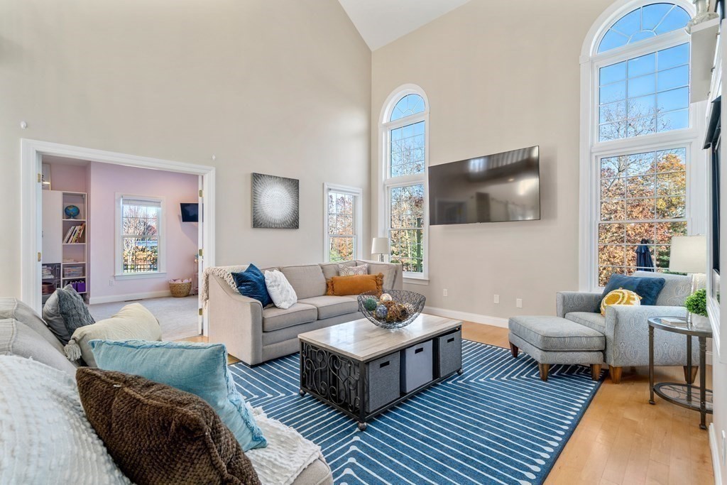 48 Mohawk Path Holliston, MA 01746 - Photo 13 of 41 a living room with furniture and a flat screen tv