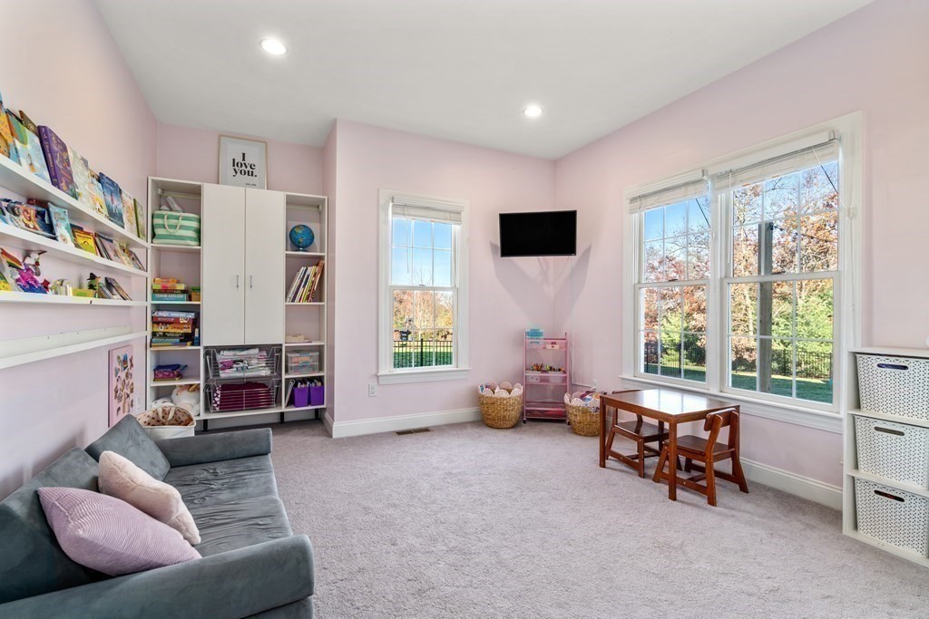 48 Mohawk Path Holliston, MA 01746 - Photo 14 of 41 a living room with furniture and a window