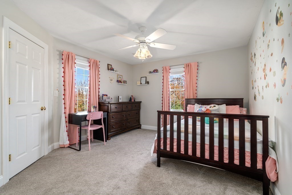 48 Mohawk Path Holliston, MA 01746 - Photo 25 of 41 a bedroom with furniture and a window