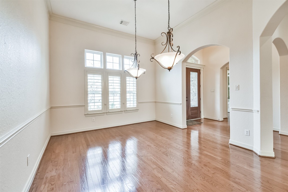 2 Sagestone Conroe, TX 77304 - Photo 22 of 50 a view of empty room with wooden floor and fan
