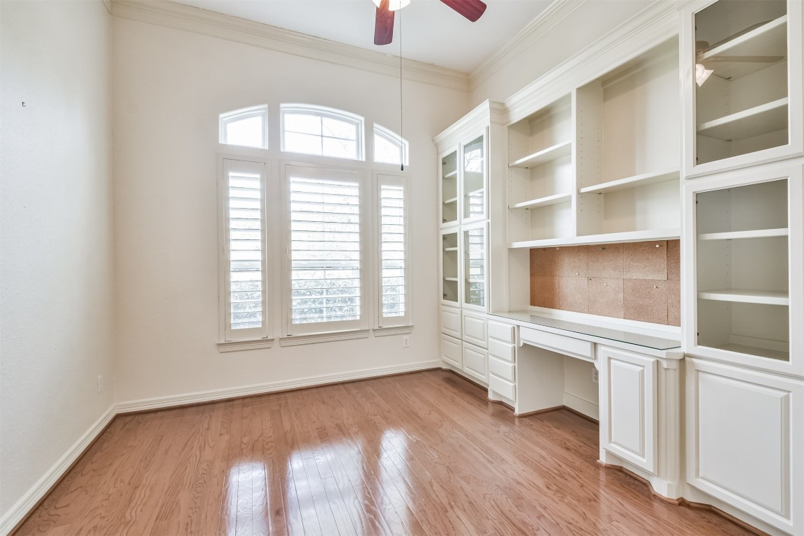 2 Sagestone Conroe, TX 77304 - Photo 23 of 50 an empty room with wooden floor and windows
