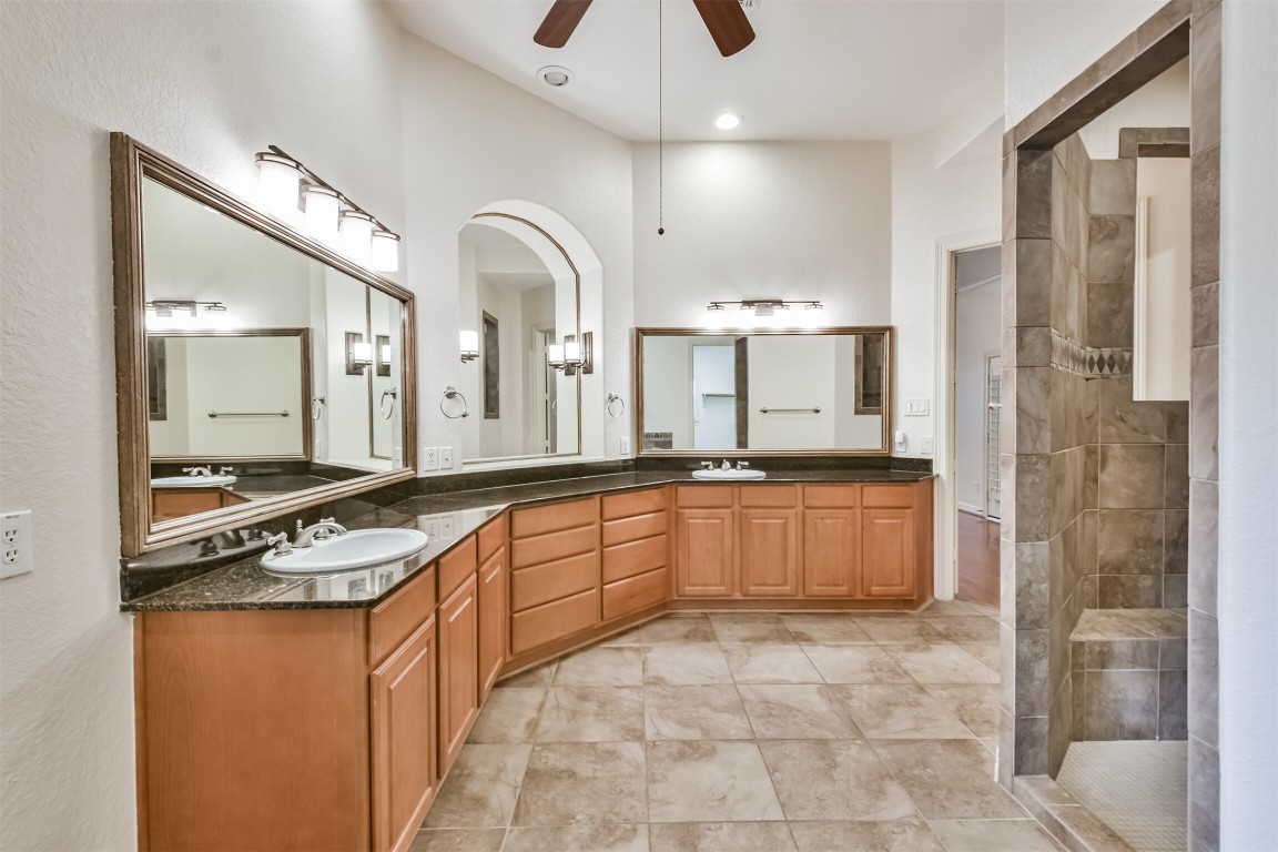 2 Sagestone Conroe, TX 77304 - Photo 28 of 50 a large kitchen with stainless steel appliances granite countertop a sink and cabinets