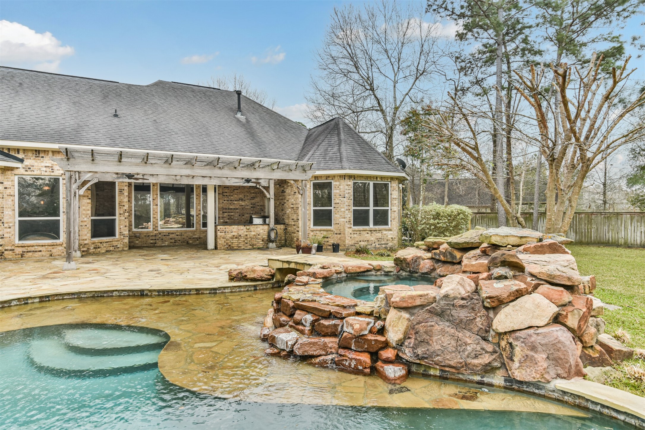 2 Sagestone Conroe, TX 77304 - Photo 49 of 50 a front view of a house with swimming pool