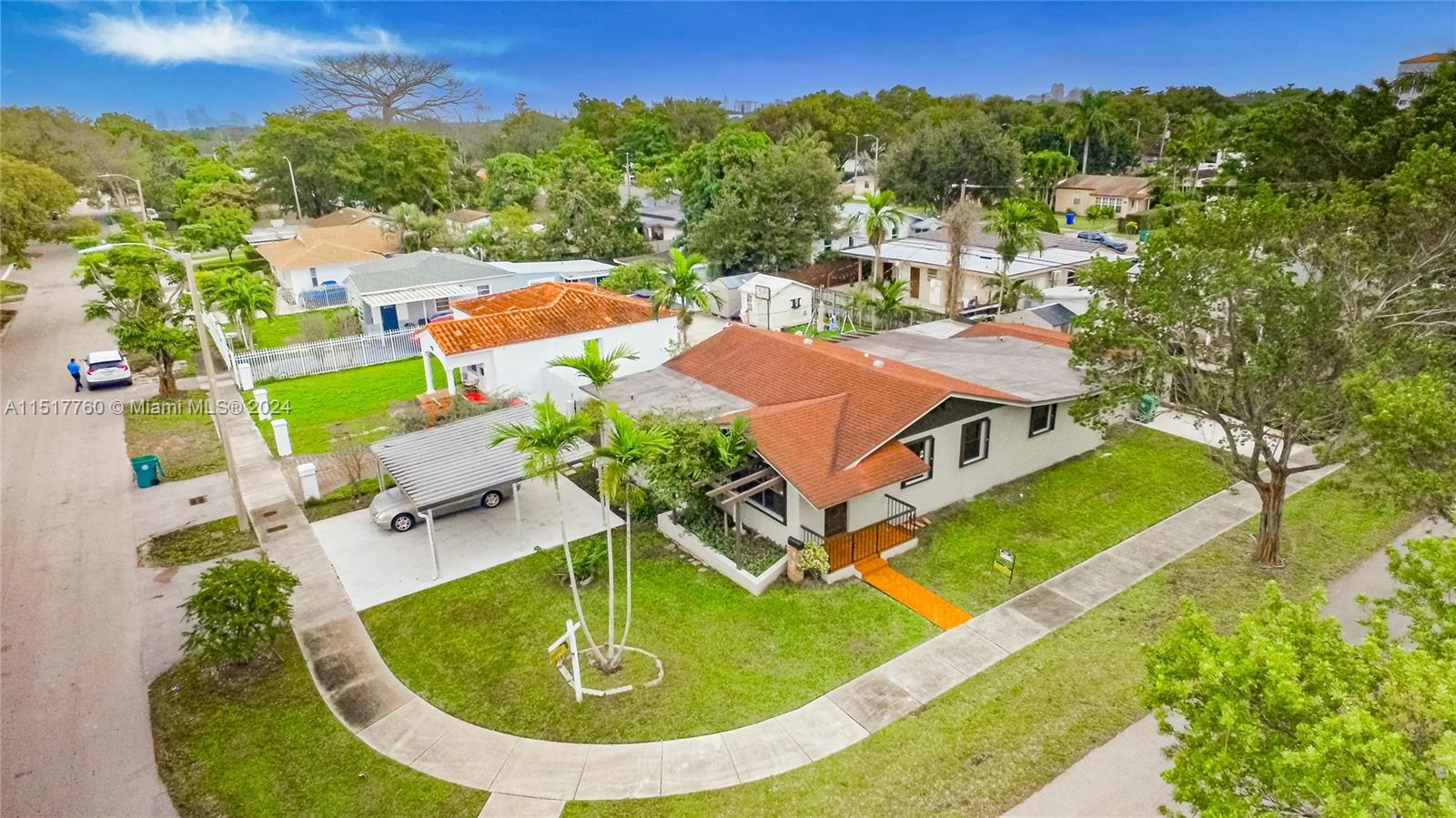 an aerial view of residential houses with outdoor space and swimming pool