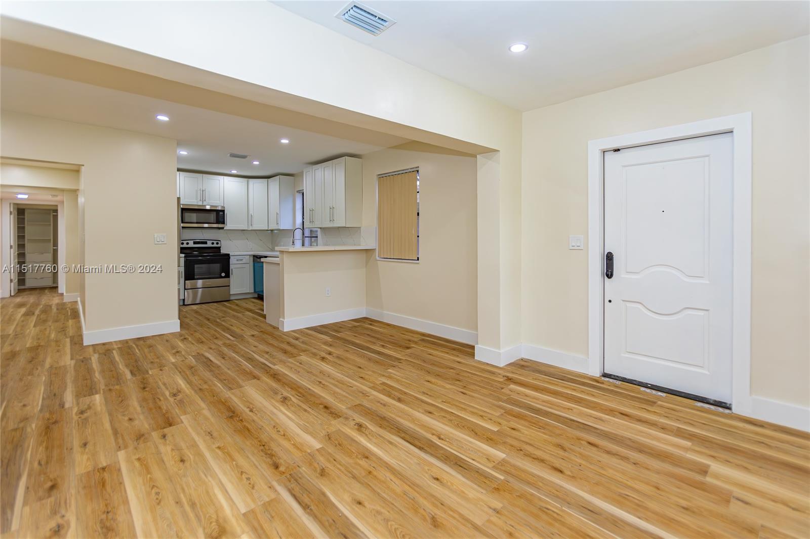 Flagami Miami, FL 33134 - Photo 9 of 44 a view of a kitchen from the hallway