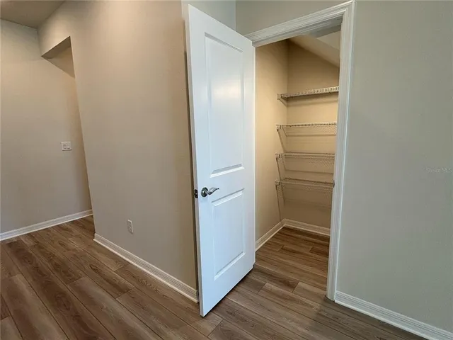 a view of an empty walk in closet