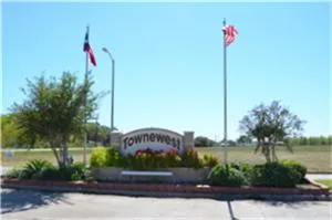 a front view of a house with a garden and plants