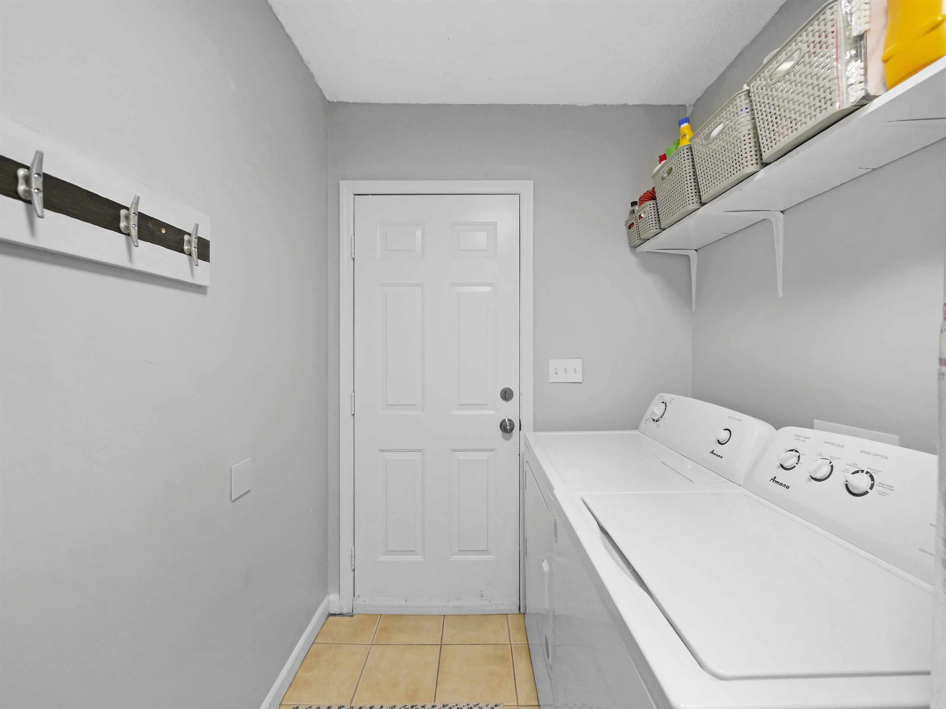 129 Rio Del Mar Street, Unit C St. Augustine, FL 32080 - Photo 19 of 26 a utility room with dryer and washer