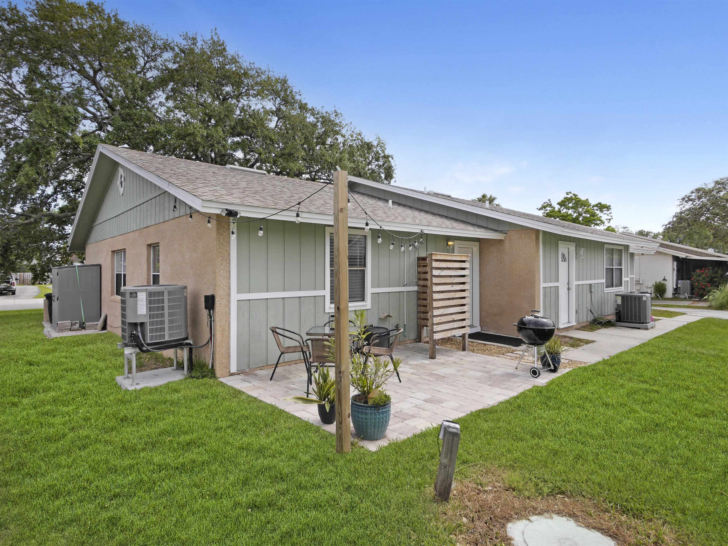129 Rio Del Mar Street, Unit C St. Augustine, FL 32080 - Photo 23 of 26 a view of a house with backyard and sitting area