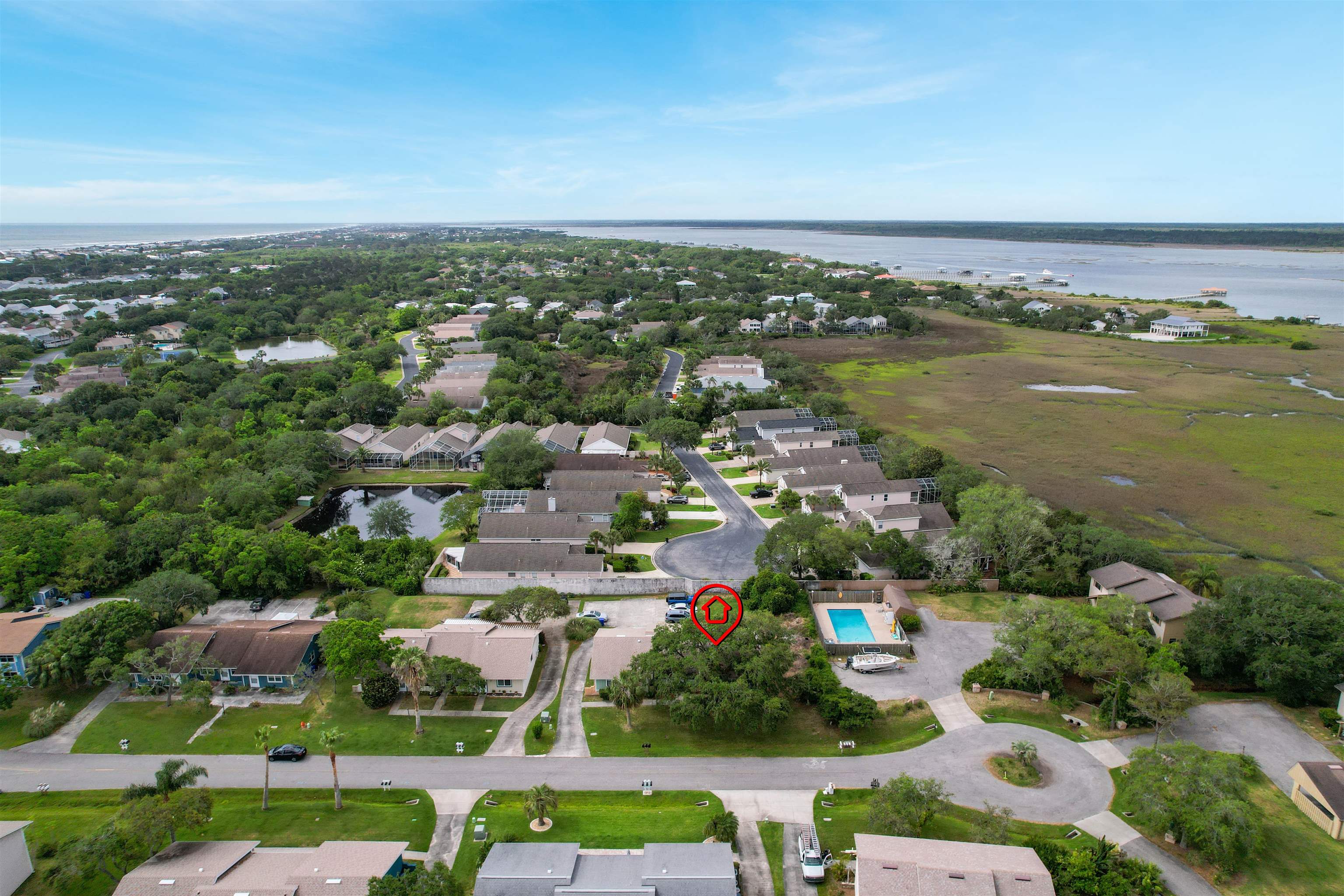 129 Rio Del Mar Street, Unit C St. Augustine, FL 32080 - Photo 24 of 26 an aerial view of a city with lots of residential buildings ocean and mountain view in back