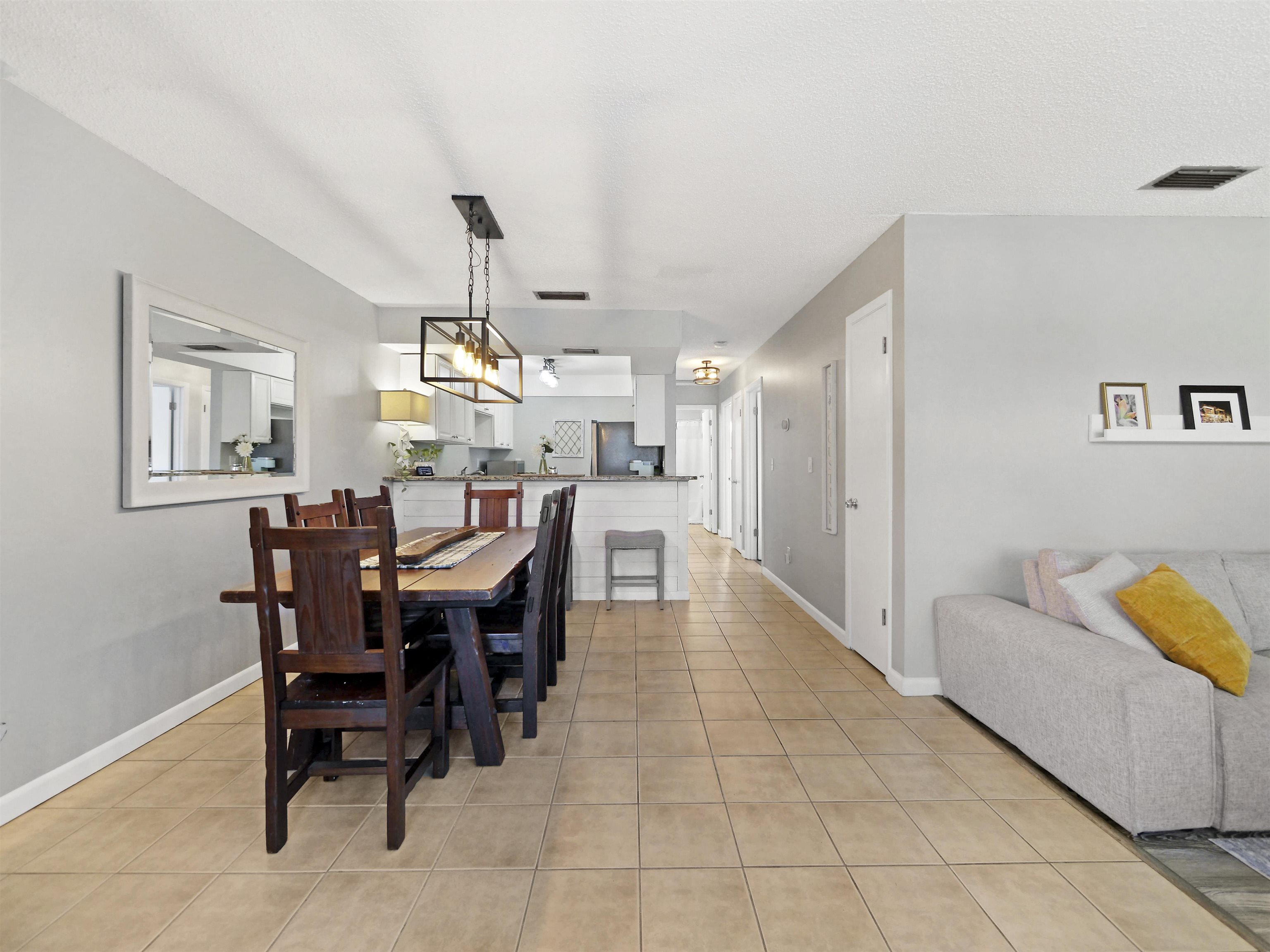 129 Rio Del Mar Street, Unit C St. Augustine, FL 32080 - Photo 4 of 26 a dining room with furniture and window