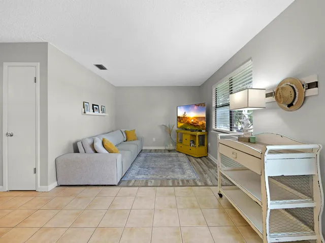a living room with furniture and a table