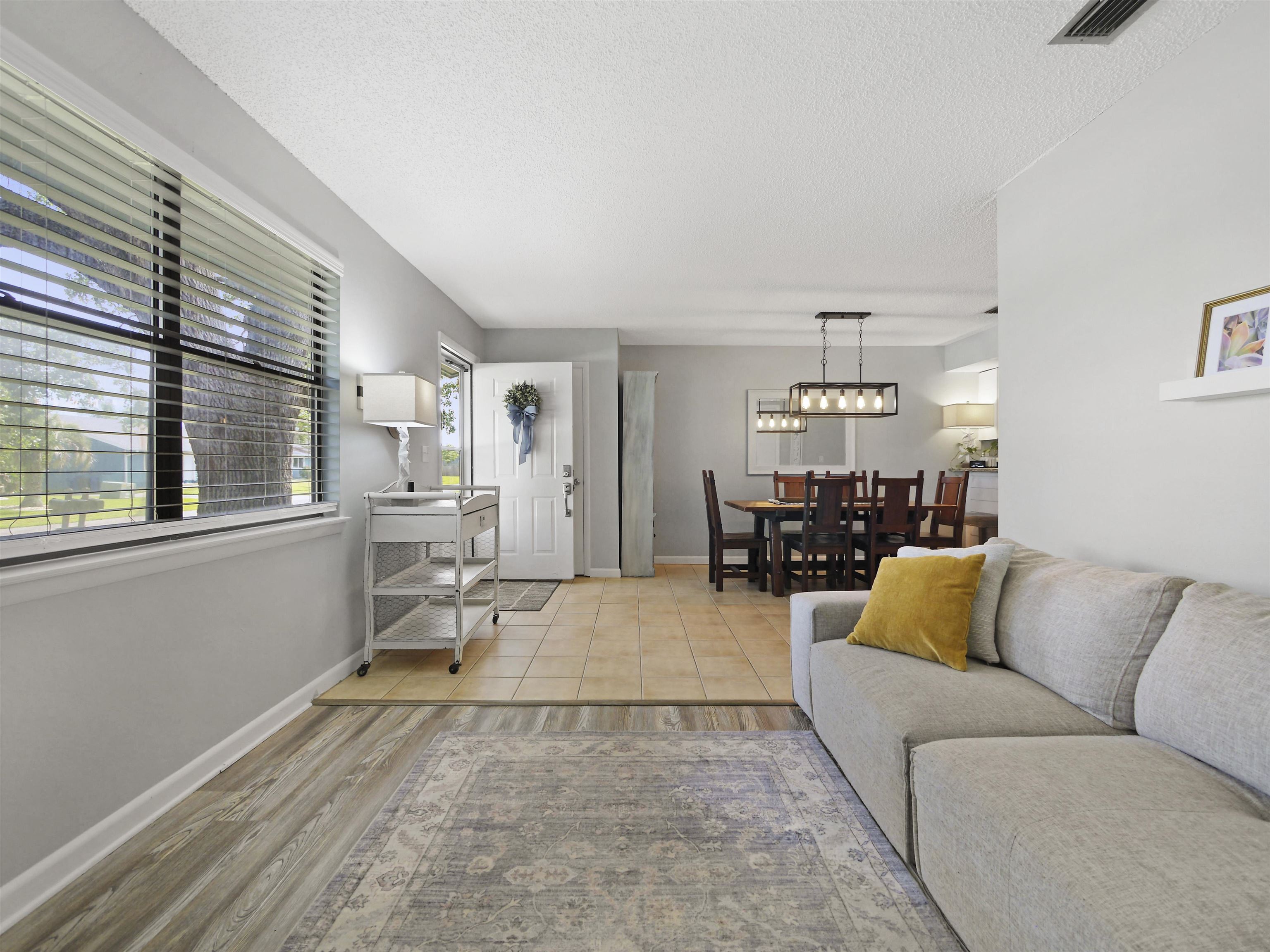 129 Rio Del Mar Street, Unit C St. Augustine, FL 32080 - Photo 7 of 26 a living room with furniture and view of kitchen