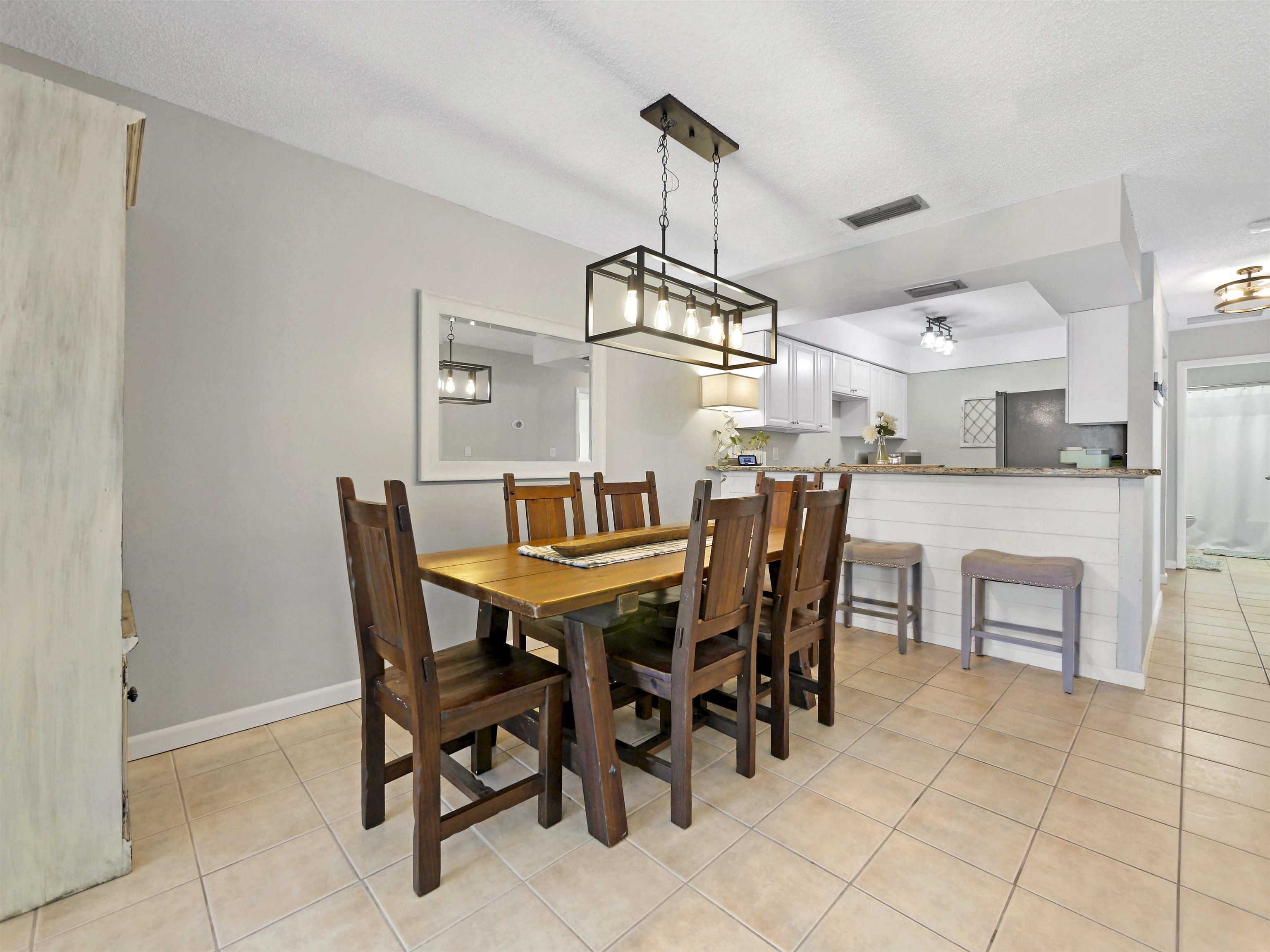 129 Rio Del Mar Street, Unit C St. Augustine, FL 32080 - Photo 8 of 26 a view of a dining room with furniture