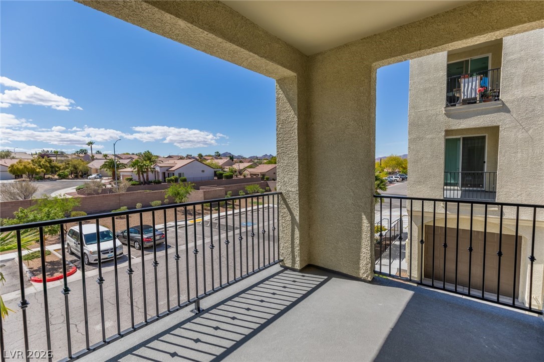 2555 Hampton Road, Unit 8206 Henderson, NV 89052 - Photo 25 of 35 Enjoy views from this balcony, overlooking the community street and neighborhood homes.