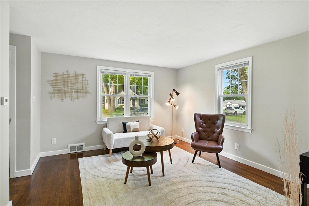 325 Hartwick Street Springfield, MA 01108 - Photo 8 of 37 a living room with furniture and a window