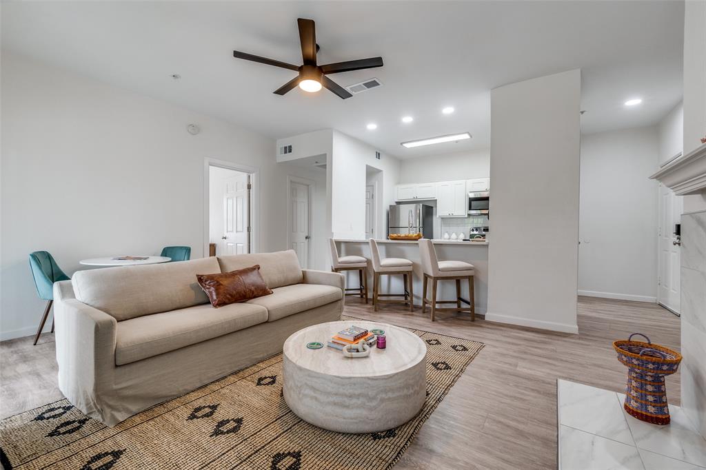 6003 Oram Street, Unit 203 Dallas, TX 75206 - Photo 1 of 25 a living room with furniture and a wooden floor