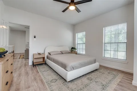 a living room with a bed furniture and a window