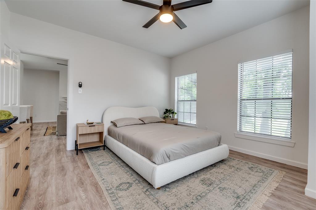 6003 Oram Street, Unit 203 Dallas, TX 75206 - Photo 17 of 25 a living room with a bed furniture and a window