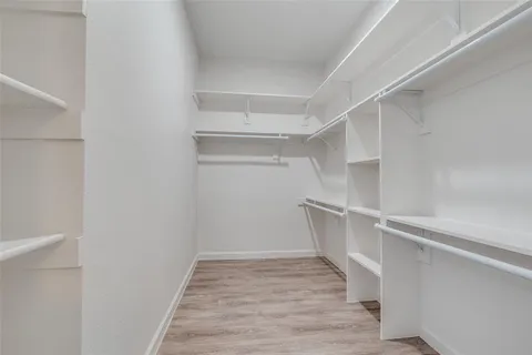 a view of an empty walk in closet
