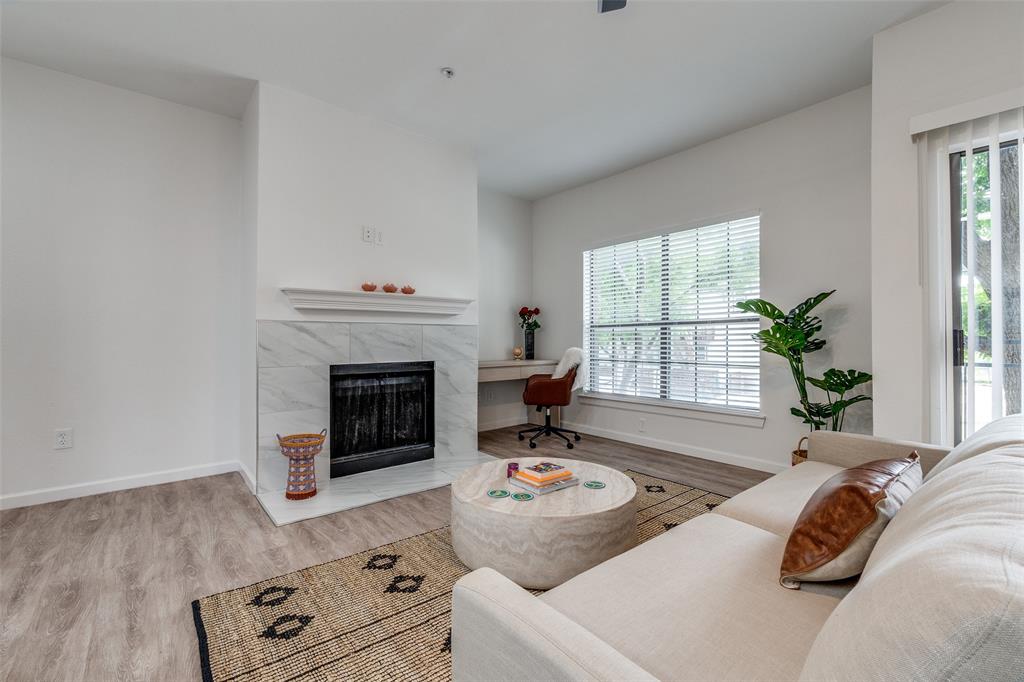 6003 Oram Street, Unit 203 Dallas, TX 75206 - Photo 6 of 25 a living room with furniture and a fireplace