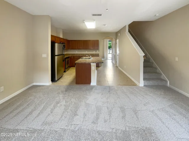 a view of a kitchen with a sink