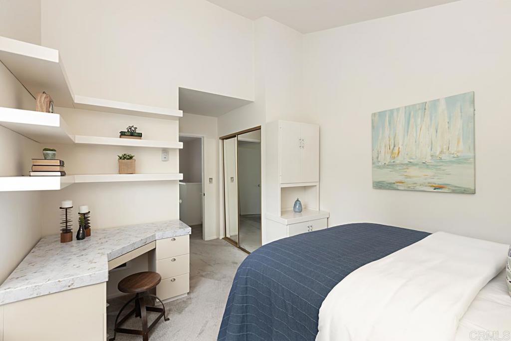 3242 Via Alicante La Jolla, CA 92037 - Photo 15 of 27 a bedroom with a bed and a cabinets