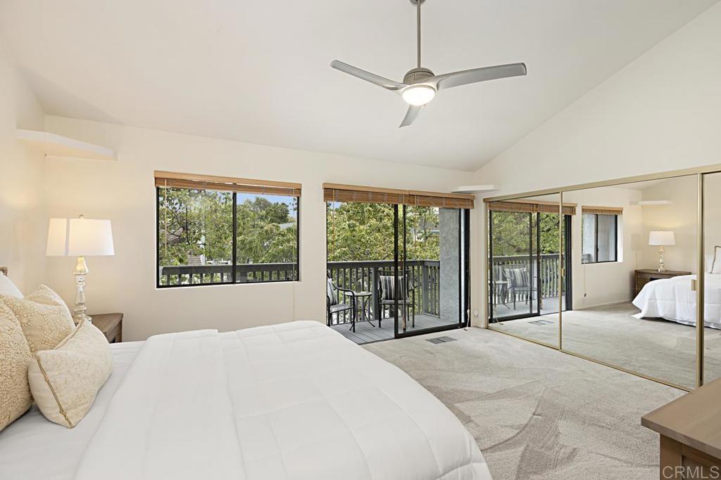 3242 Via Alicante La Jolla, CA 92037 - Photo 17 of 27 a spacious bedroom with a large bed and a large window
