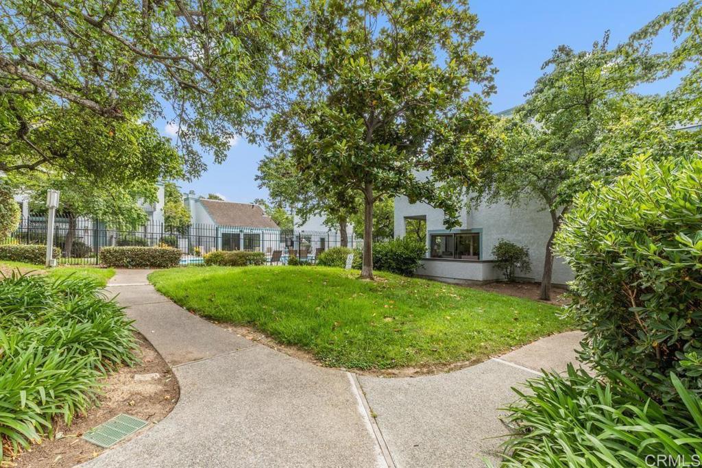 3242 Via Alicante La Jolla, CA 92037 - Photo 25 of 27 a front view of a house with a garden and trees