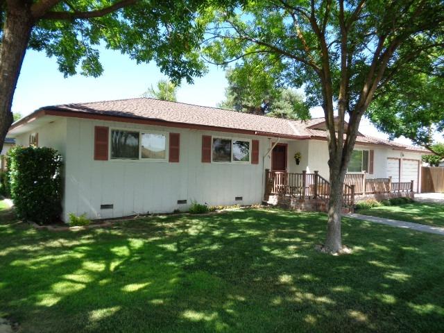 676 West Huntsman Avenue Reedley, CA 93654 - Photo 1 of 18 a backyard of a house with table and chairs