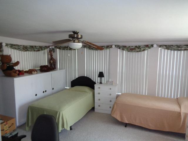 676 West Huntsman Avenue Reedley, CA 93654 - Photo 13 of 18 a bedroom with furniture and a window