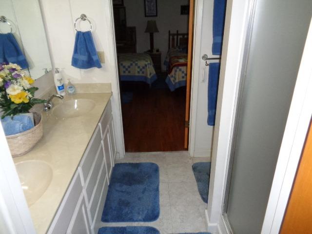 676 West Huntsman Avenue Reedley, CA 93654 - Photo 6 of 18 a bathroom with a sink and a mirror