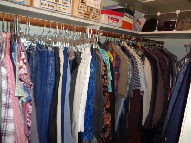 676 West Huntsman Avenue Reedley, CA 93654 - Photo 7 of 18 a view of walk in closet with clothes and shoes