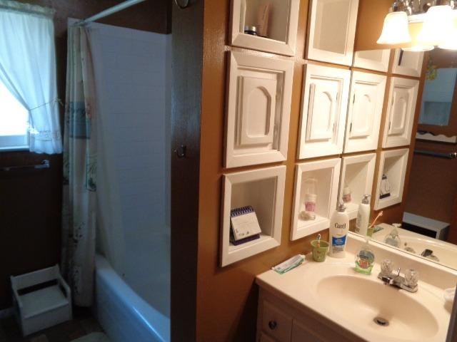 676 West Huntsman Avenue Reedley, CA 93654 - Photo 9 of 18 a bathroom with a sink and a mirror