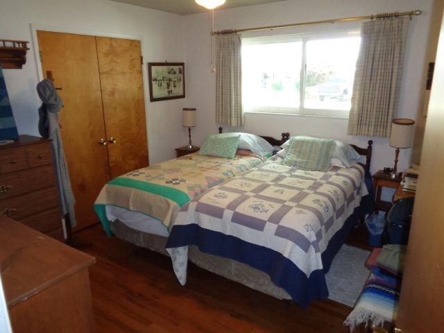 676 West Huntsman Avenue Reedley, CA 93654 - Photo 10 of 18 a bedroom with a bed and a window