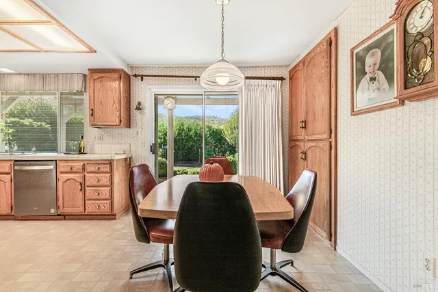 a kitchen with granite countertop a stove top oven sink and cabinets