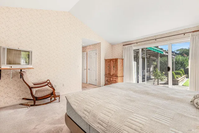 a bathroom with a toilet sink a mirror and shower