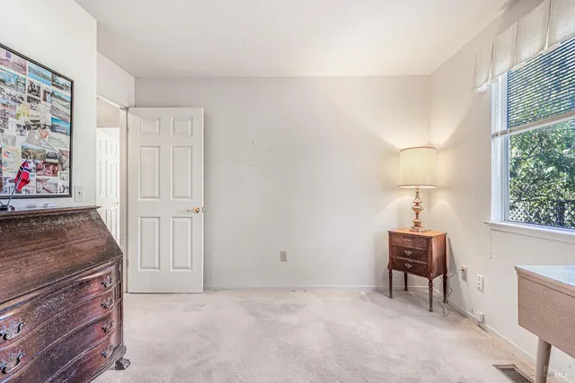 a view of a hallway with wooden shelves