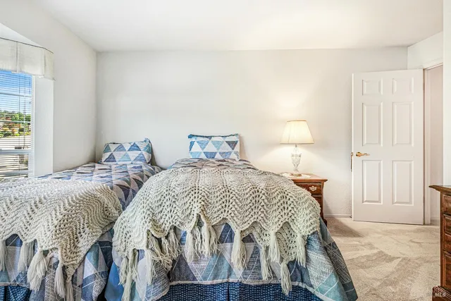 a view of a patio with a table chairs and a patio