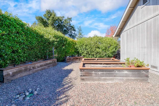 a front view of house with outdoor space and garden
