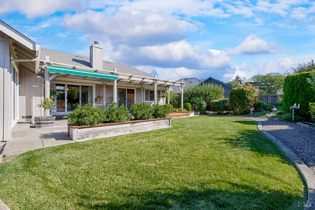 a view of a house with potted plants