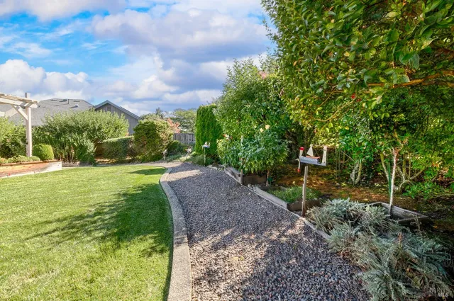 a view of a porch with furniture and garden view