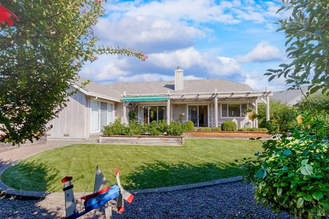 a bedroom with a bed and a refrigerator