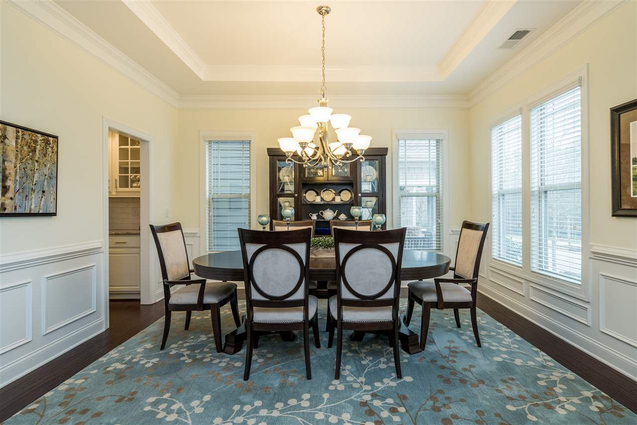 5616 Wade Park Boulevard Raleigh, NC 27607 - Photo 7 of 30 Beautiful and bright dining room with tray ceiling. Conveniently connects to the kitchen with short hallway including butler pantry and pantry. Dining Room