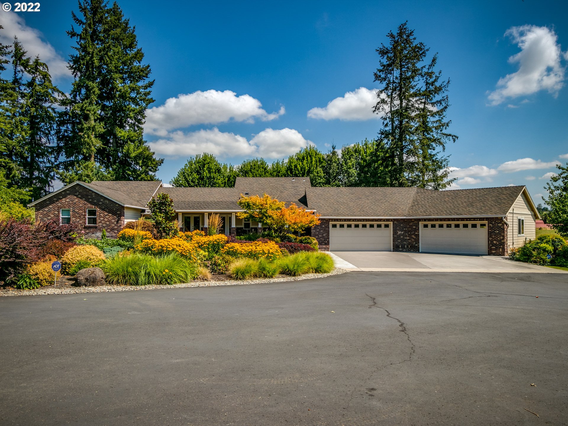 3515 Northwest 221st Street Ridgefield, WA 98642 - Photo 1 of 32 a view of a house with a street and a yard