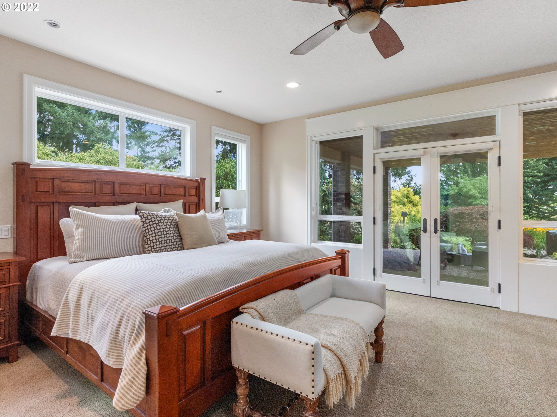 3515 Northwest 221st Street Ridgefield, WA 98642 - Photo 13 of 32 a bedroom with a bed and glass door